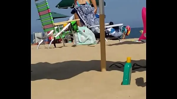 Watch Candid on this little slut at the beach power Tube