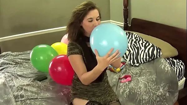 Watch Blowing Balloons and Popping Them While Chewing Bubblegum power Tube