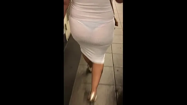 Wife in see through white dress walking around for everyone to see पावर ट्यूब देखें